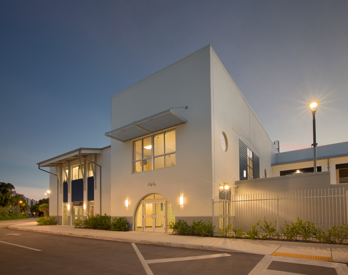 Architectural dusk view of the Pinecrest prep charter k-12 school in Miami.